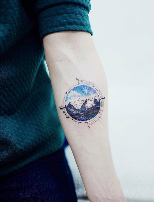 τατουαζ για τον ταυρο με βουνά που διαπερνούν τα σύννεφα
